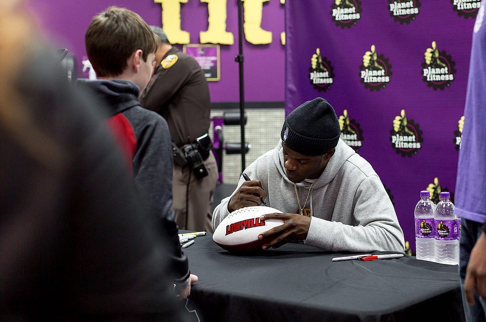Lamar Jackson signing footballs
