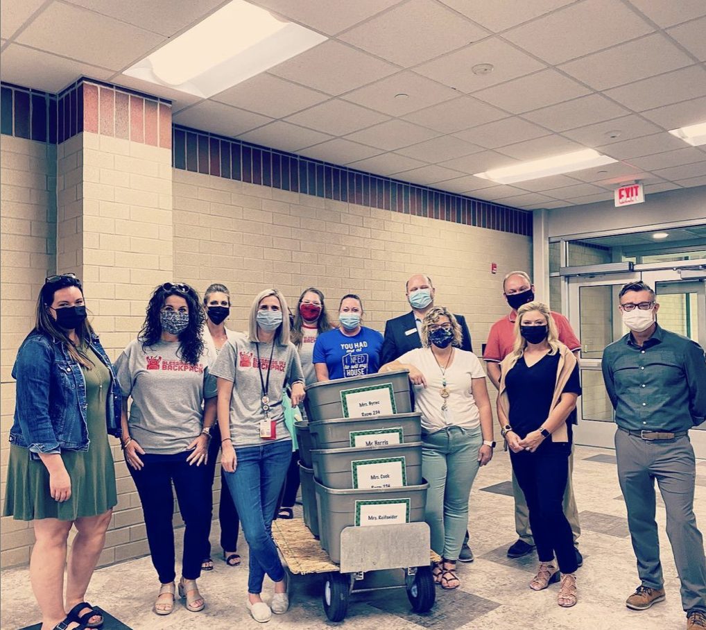 New Albany leaders volunteer to pack food for Blessings in a Backpack