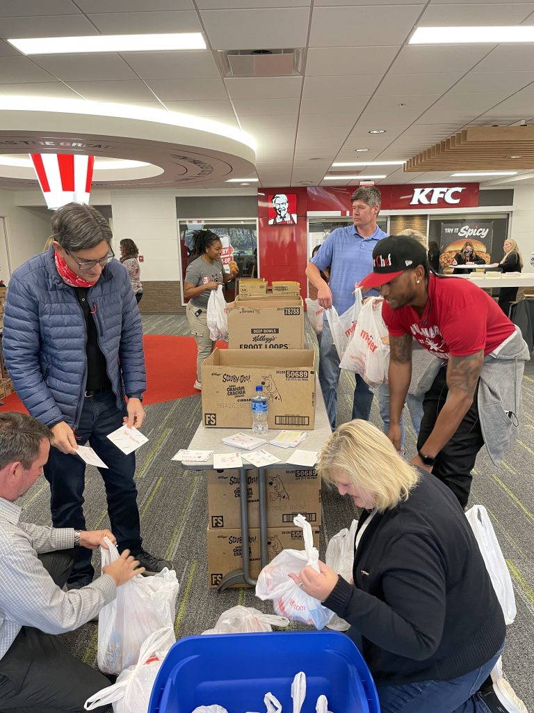 KFC, Darnell “SuperChef” Ferguson, pack 1,500 bags of food for local kids