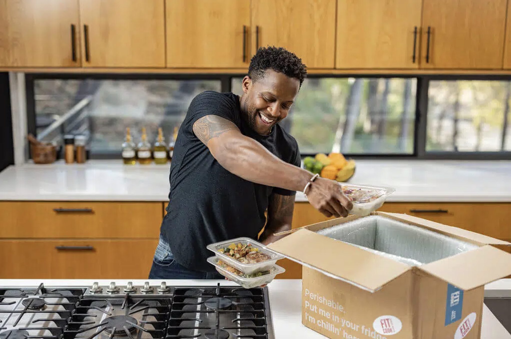 Kevin Curry of FitMenCook Celebrates Blessings in a Backpack Volunteers